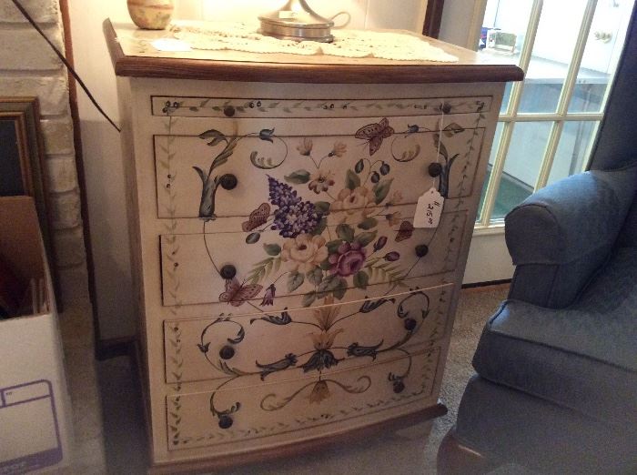 Soft hued hand-painted  chest.  This unique accents chest has a beautiful front and sides.