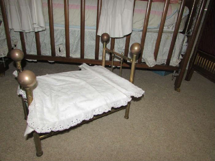 Charming brass doll bed.