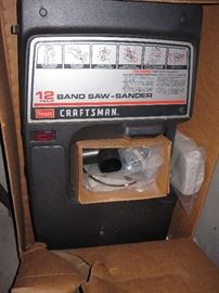 new in box, band saw and sander