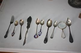 Antique silverware and magnifying glass