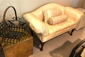 settee, brass box with handles pictured as an end table, wrought iron basket