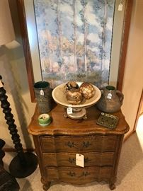 Darling little side table, pictured you see some decorative items as well as some Red Wing pottery, great art all over this home as well!