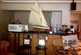 Model Sailboat, microwave, bar goods, bar stools, cane chairs