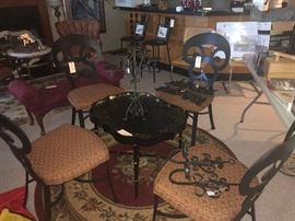 Antique tray table, wrought iron decor, 4 heavy cast metal chairs with custom fabric, lots of area rugs