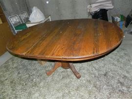 Oak pedestal table with leaf and 6 matching chairs. $250.00
