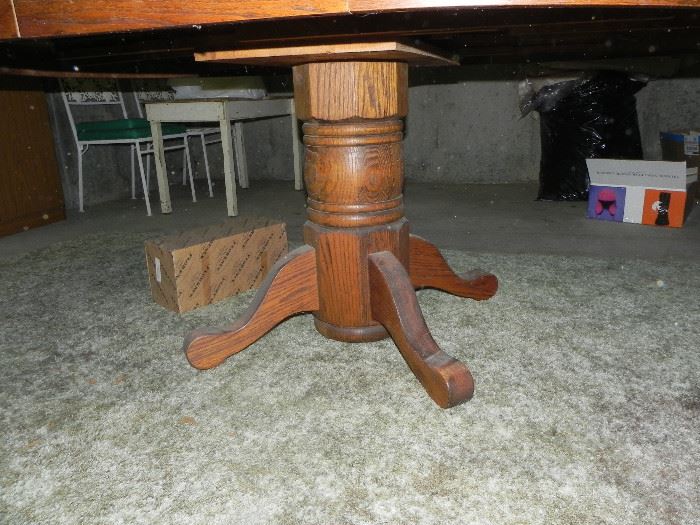 Oak pedestal table with leaf and 6 matching chairs. $250.00