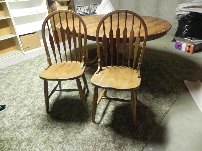 Oak pedestal table with leaf and 6 matching chairs. $250.00