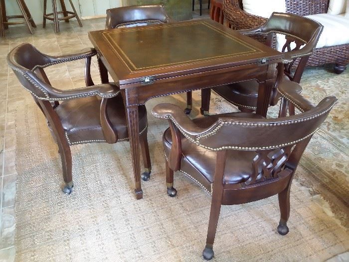 Game table and 4 leather chairs.