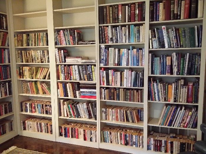 The study has a huge selection of books.  There are several more shelves.