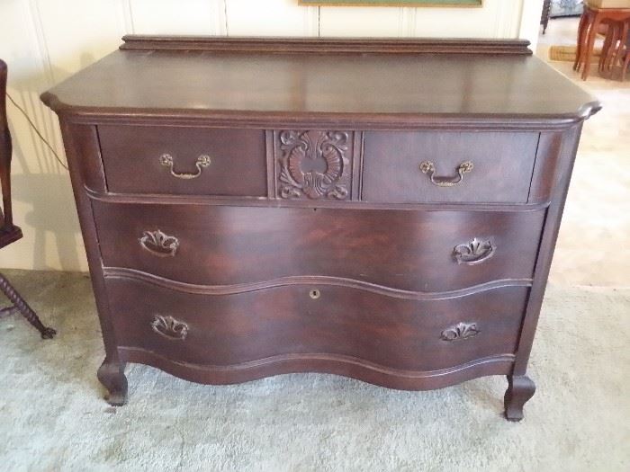 Antique oak chest with serpentine drawers