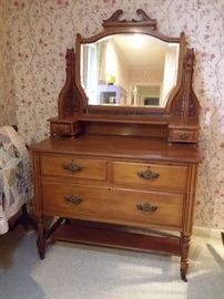 Antique dresser with glove boxes and beveled mirror