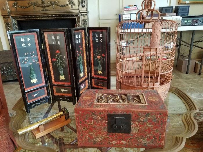 Glass top coffee table with brass trim, Oriental mini screen with jade & coral applied flowers - the back is painted, oriental handmade birdcage, oriental hand carved box, brass kaleidoscope 