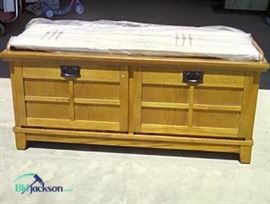 Lexie Wood storage bench. This is a great piece of furniture that will look good in any room.   The cover/cushion is still in its original packaging.  