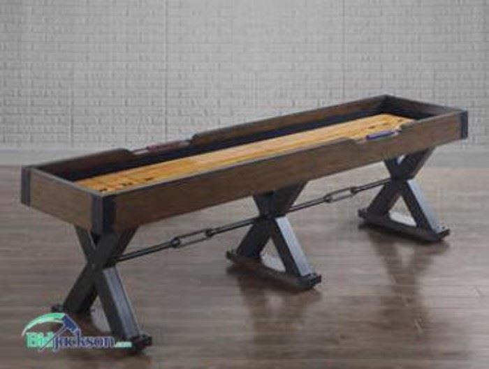 Vintage 9ft shuffleboard that is brand new.  It is truly one of the finest pieces of gaming furniture that you'll find.   Fully assembled so that you can pick up and start playing immediately!