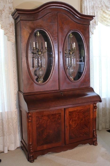 038c  Walnut Victorian secretary bookcase with oval glass doors and slant front, 93 in. T, 49 in. W, 24 in. D.