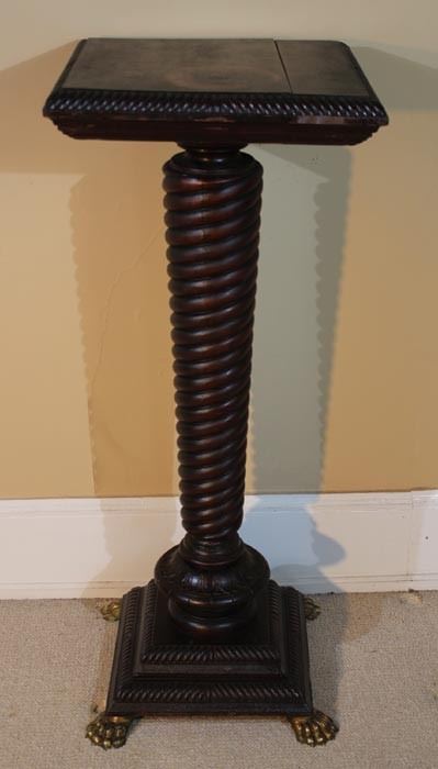 056a  Twisted mahogany base pedestal with brass claw feet, 42 in. T, 17 in. Sq.