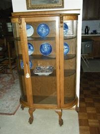 BEAUTIFULLY REFINISHED  ANTIQUE CURVED GLASS CHINA CABINET WITH KEY. LIONS HEAD AND CLAWFOOT