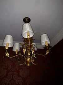 Gilt leaf decorated six light chandelier