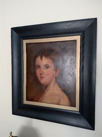Framed oil painting of a young child