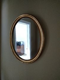 Oval gilt decorated mirror