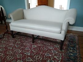 Camel back sofa with Chippendale style legs