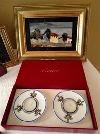 Cartier candle holders and a Gina Contini Studio mosaic