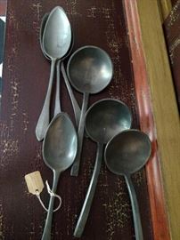 Antique pewter spoons and ladles