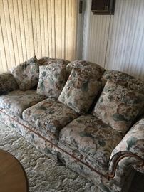 Bassett floral couch with wood trim approx 35 inch ht  38 inch depth  92 inch long, beautiful condition