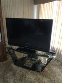 Toshiba 52 inch flat screen   2008 model                        Model # 52RV53U  Serial AM409001510                                TV stand, glass 3 shelves  approx 21 inch ht  19 inch wide and 5 ft long