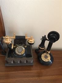 Vintage phones, one on the right is the Candlestick Telephone