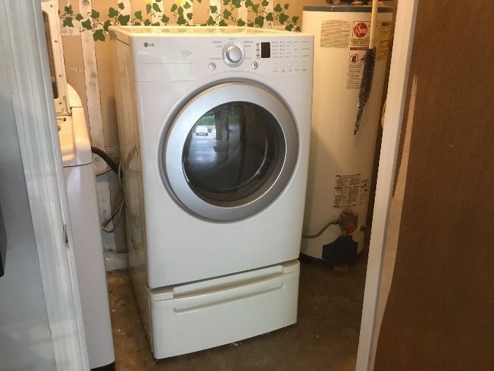 LG dryer with storage container - this is in utility room in garage