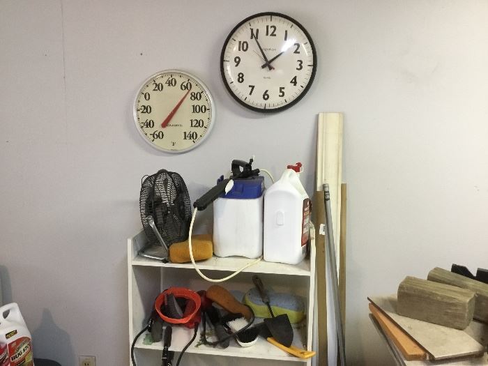 Clock, temperature gauge, small white shelf 