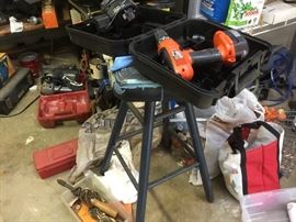 Lots of power tools and several stools