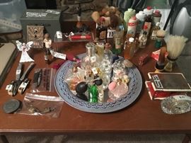 Old post office box doors with window; assortment of vintage atomizer bottles, shaving items