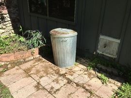 2 metal garbage cans