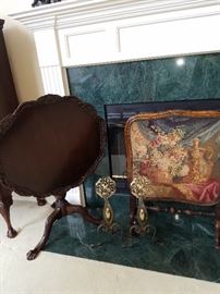 Tilt-top mahogany table, Tapestry framed fire screen and a pair of Dutch-looking andirons