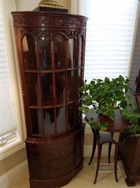 The other curved mahogany corner cabinet, beside the other swan neck stand