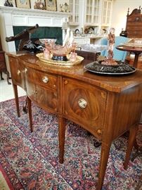 Inlaid mahogany sideboard or credenza displaying pink and black depression glass items