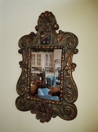Carved armorial mirror