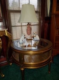 Gilt finish vitrine table for display. Lamp is Lenox...mid 1900's