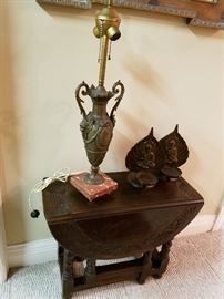 Small carved drop-leaf table.  Great old lamp...never found an appropriate shade. 