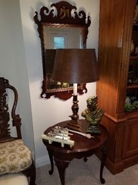 Eagle crest mirror, round lamp table, lamp, dinner chimes on table