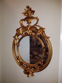 This is rather small (but hard to tell in the photo). Cute gilt mirror!