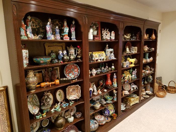 Four sections of book case displaying Oriental and other decorative items. (Bookcases are for sale, but we ask that they remain until the last day of the sale, Friday, May 18th)