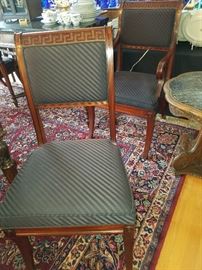 These chairs (8 side and two 2 arm) are Baker.  They are displayed with the dining table, but will be priced separately.