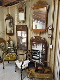 Store room full of furniture and mirrors.  