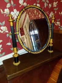 The oval mirror on stand (or shaving mirror)