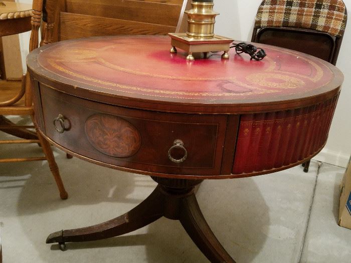 Leather top drum table with faux book trim.  This one doesn't rotate like the earlier one does