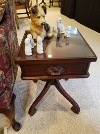 Carl Forslund cherry stand (one of two matching) with glass top. Displaying figures of dogs