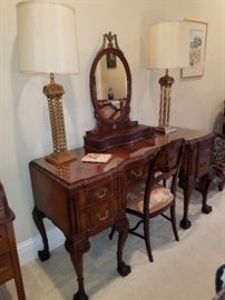 Irwin (Grand Rapids) ornate and lovely desk displaying a shaving mirror and a pair of architectural influenced lamps